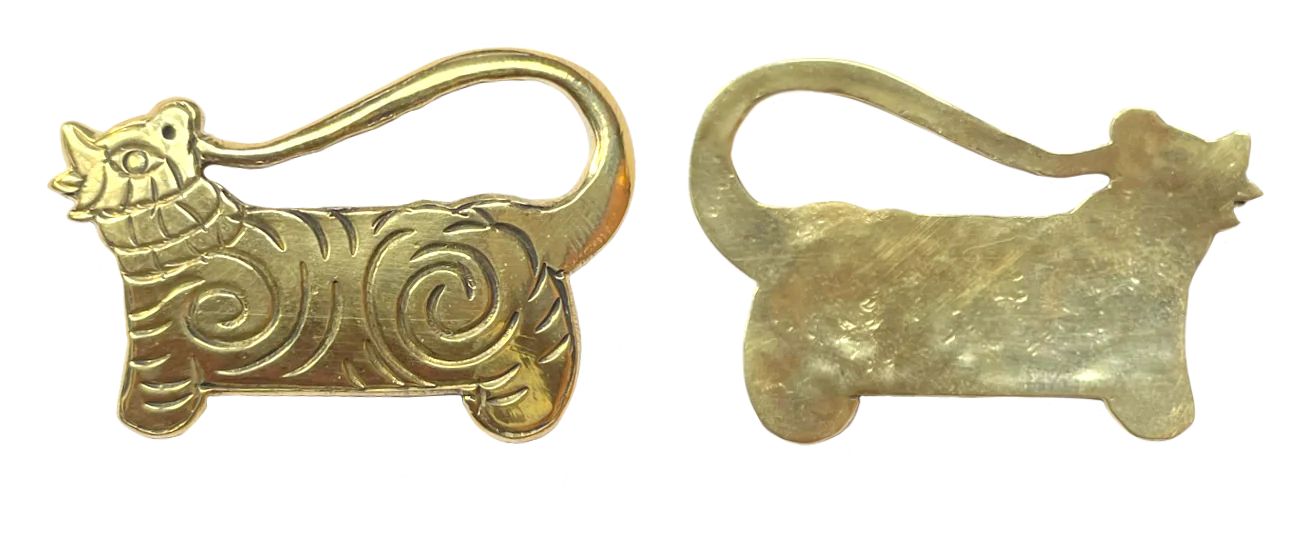 the brass tiger charm, front and back