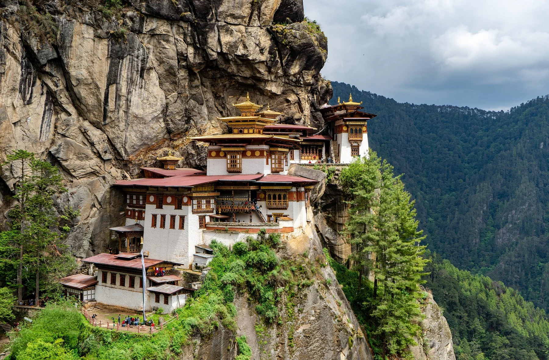 Paro Taktsang, the Tiger’s Nest monastery, clinging to a cliff above the forest in Bhutan